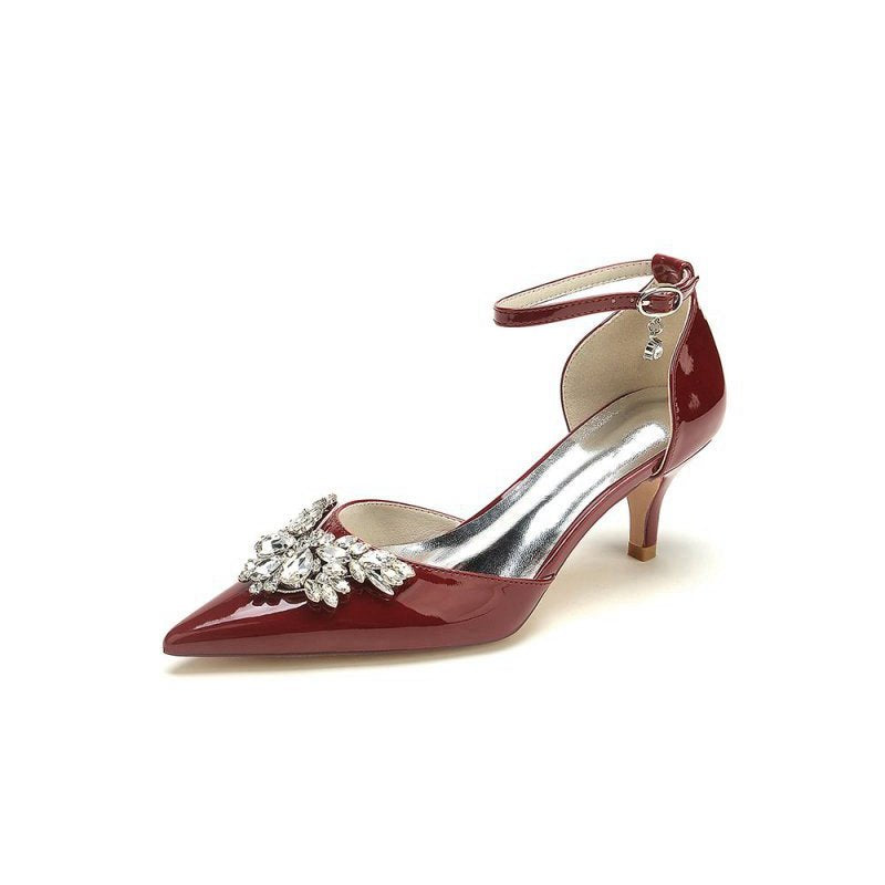 Elegant Patent Leather High Heels with Large Crystal Embellishment